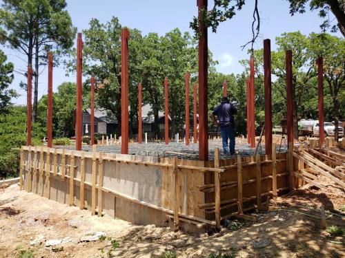 construction-process-stages-concrete-forms-steel-framing