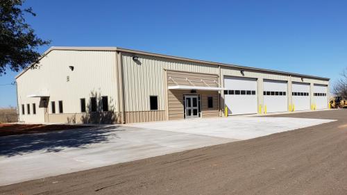 large-steel-building-overhead-door-awning-multiple-garage-bays