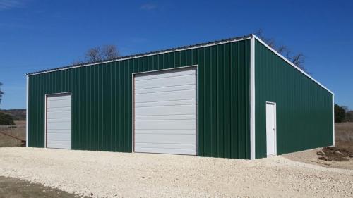 steel-building-overhead-door-barn-livestock-shed